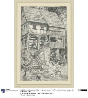Umgebindehaus in Herrnskretschen mit Felsen im Hintergrund