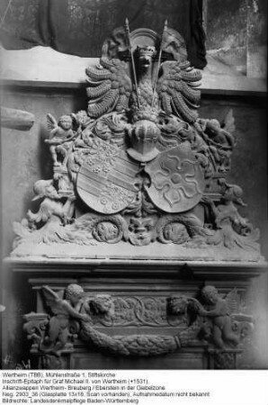 Stiftskirche; Inschrift-Epitaph für Graf Michael II. von Wertheim (+1531), Allianzwappen Wertheim- Breuberg / Eberstein in der Giebelzone