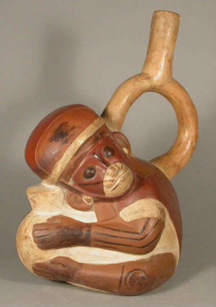 Figure vessel with stirrup spout