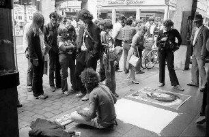 Freiburg i. Br.: Straßenmaler an der Ecke Rathausgasse