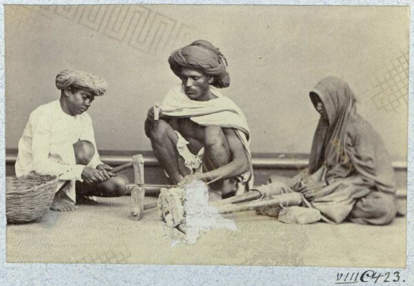 Three blacksmiths at work