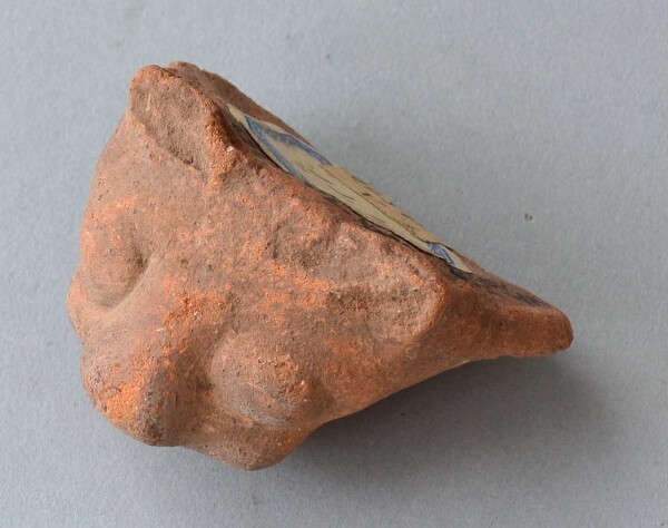 Clay head (vessel fragment)