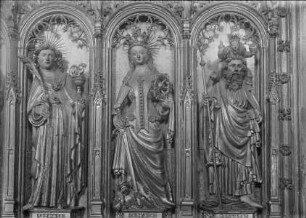 Kreuzigungsaltar — Linker Altarflügel: Verkündigung und Heimsuchung — Die Heiligen Johannes Evangelista, Katharina und Christophorus