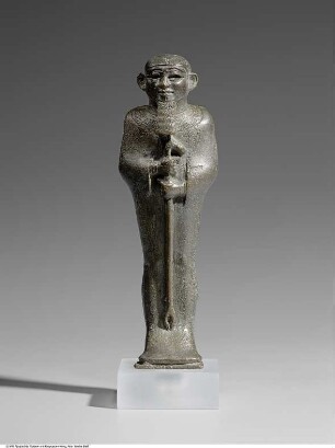 Statuette des mumiengestaltigen Gottes Ptah mit einem Was-Zepter, mit ehemals eingelegten Augen