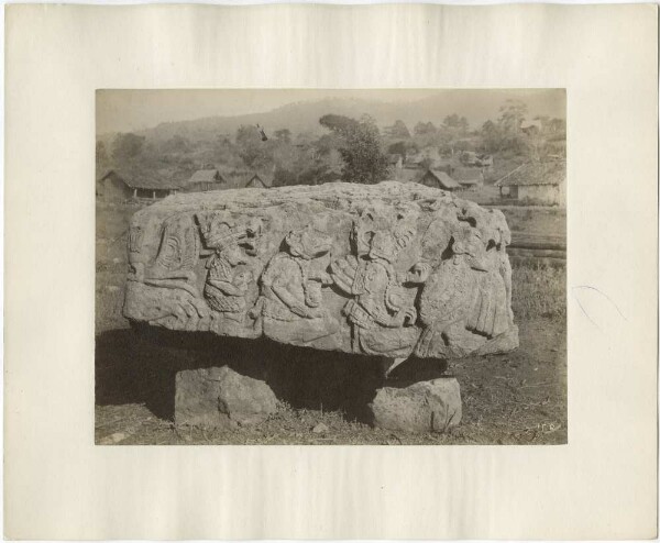 Altar T, south-east side (west side?). The village of Copán in the background.