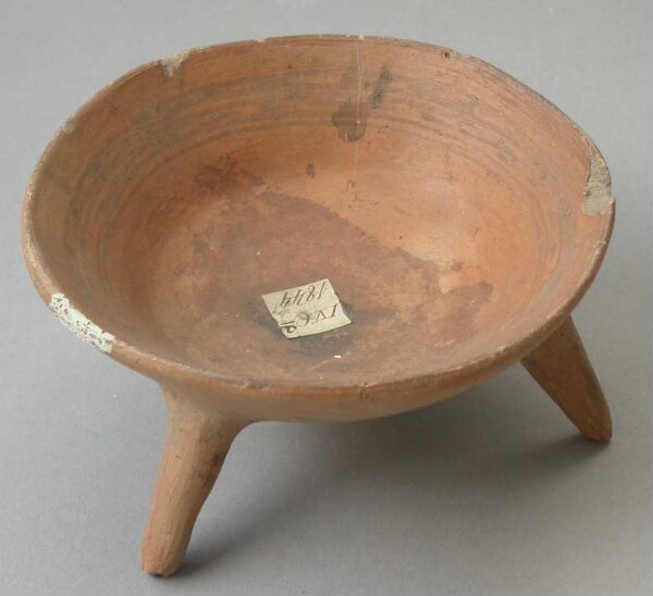 Three-footed clay bowl