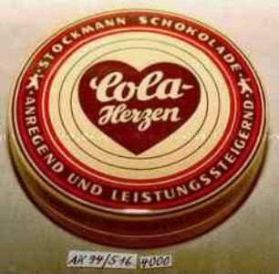 Blechdose für "Cola-Herzen STOCKMANN SCHOKOLADE ANREGEND UND LEISTUNGSSTEIGERND"