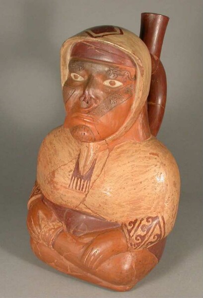 Seated anthropomorphic figure with facial mutilation