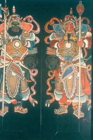 Guangzhou (Kanton). Ahnentempel der Familie Chen. Tor-Gottheiten auf den Flügeln des Tores
