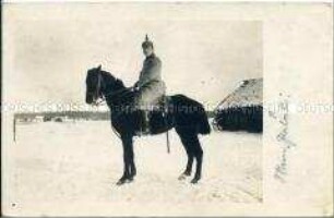 Soldat zu Pferde, in Winterlandschaft