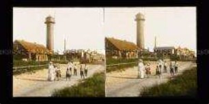 Personengruppe vor dem Leuchtturm, Wangerooge