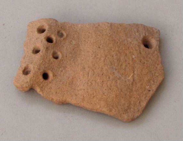 Fragment of a clay vessel