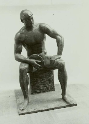 Sitzender Diskuswerfer