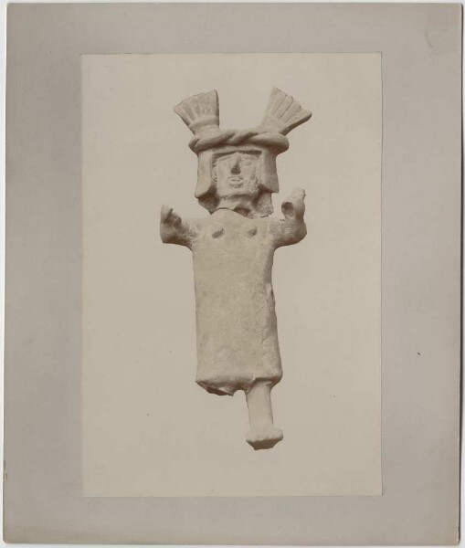 Clay figure with broken leg.