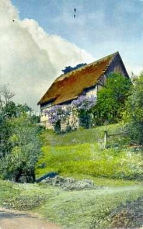 Ansicht eines Bauernhauses an einem Hang