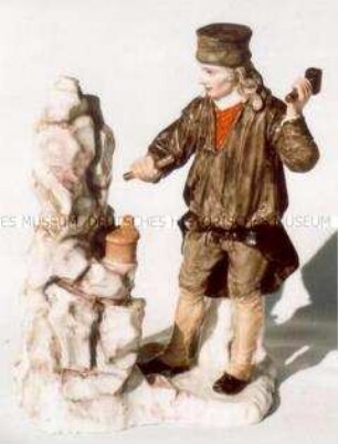 Bergmann bei der Arbeit am Felsen (Einmannbohrer)