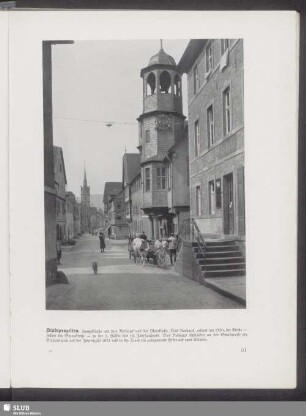 Stadtprozelten. Hauptstraße mit dem Rathaus und der Pfarrkirche