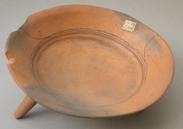 Three-footed clay bowl