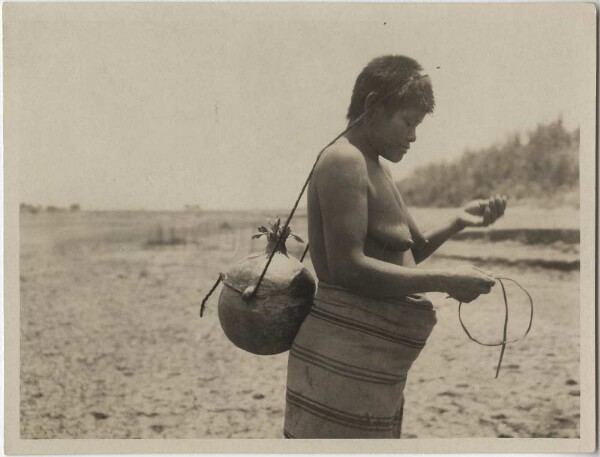 Choroti fetches water from the Rio Pilcomayo