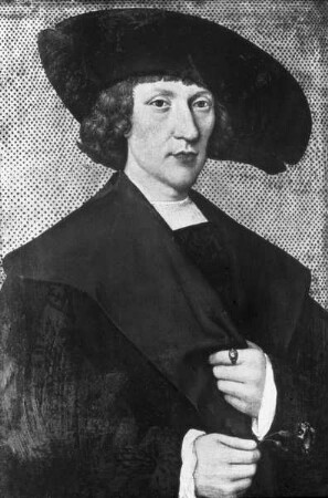 Portrait eines jungen Mannes mit großem Hut und einer Nelke