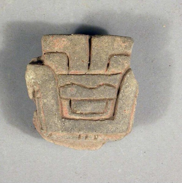 Fragment of a clay vessel