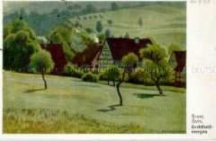 Herbstliche Hügellandschaft mit Fachwerkhäusern